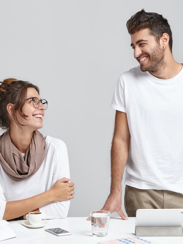 people-business-teamwork-and-cooperation-concept-creative-happy-young-woman-and-bearded-man-desig.jpg